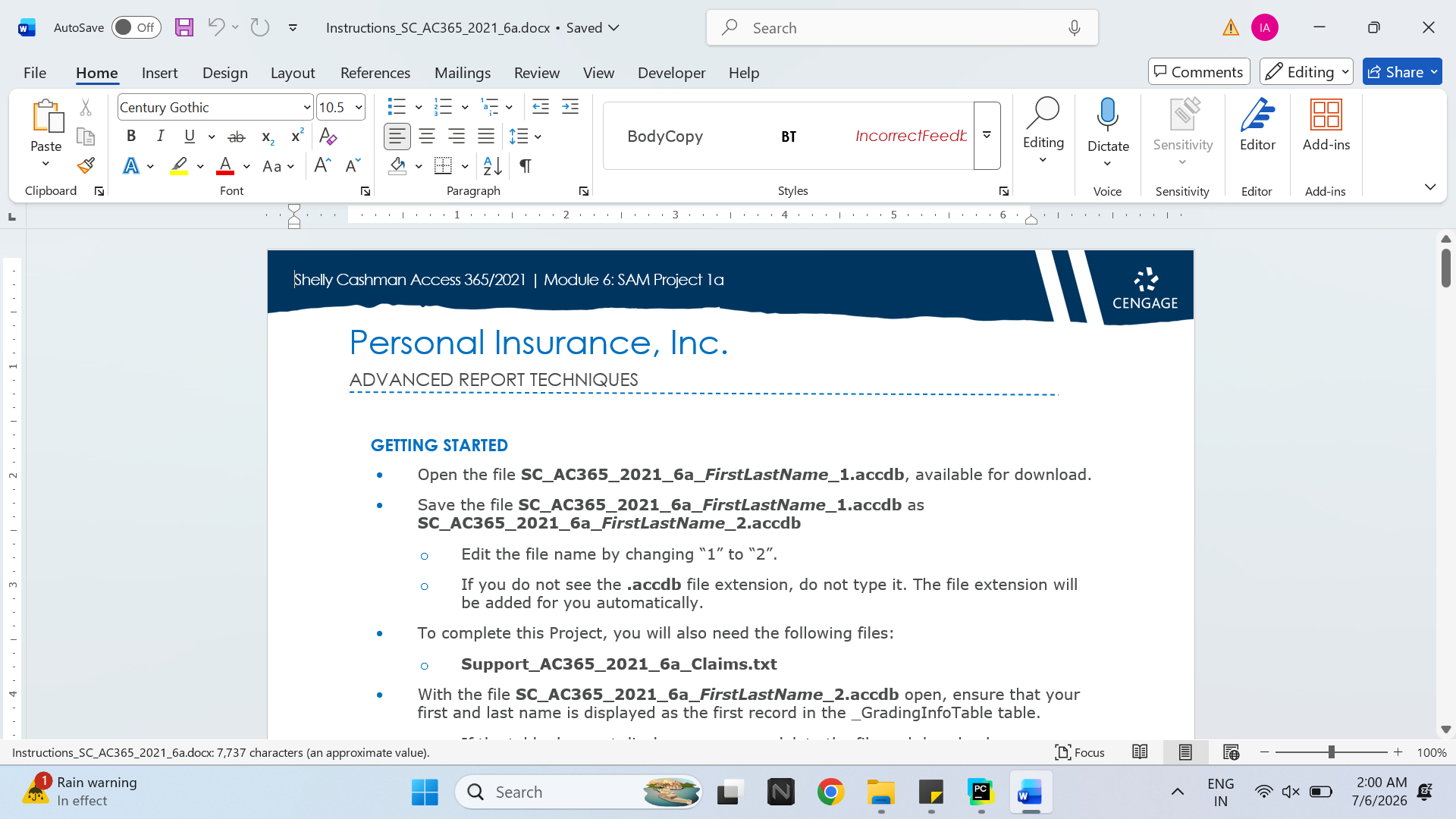 Laptop and spreadsheet workspace